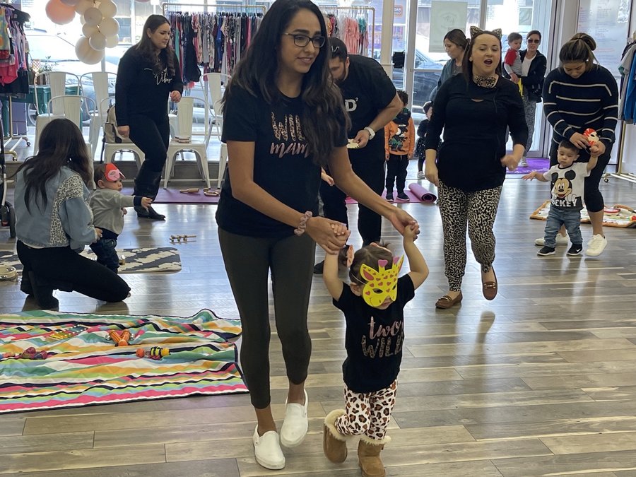 Liz Hallack helps her daughter Elena as she tries to follow along with the lessons at the Little Tunes studio in downtown Turlock (PAWAN NAIDU/The Journal).