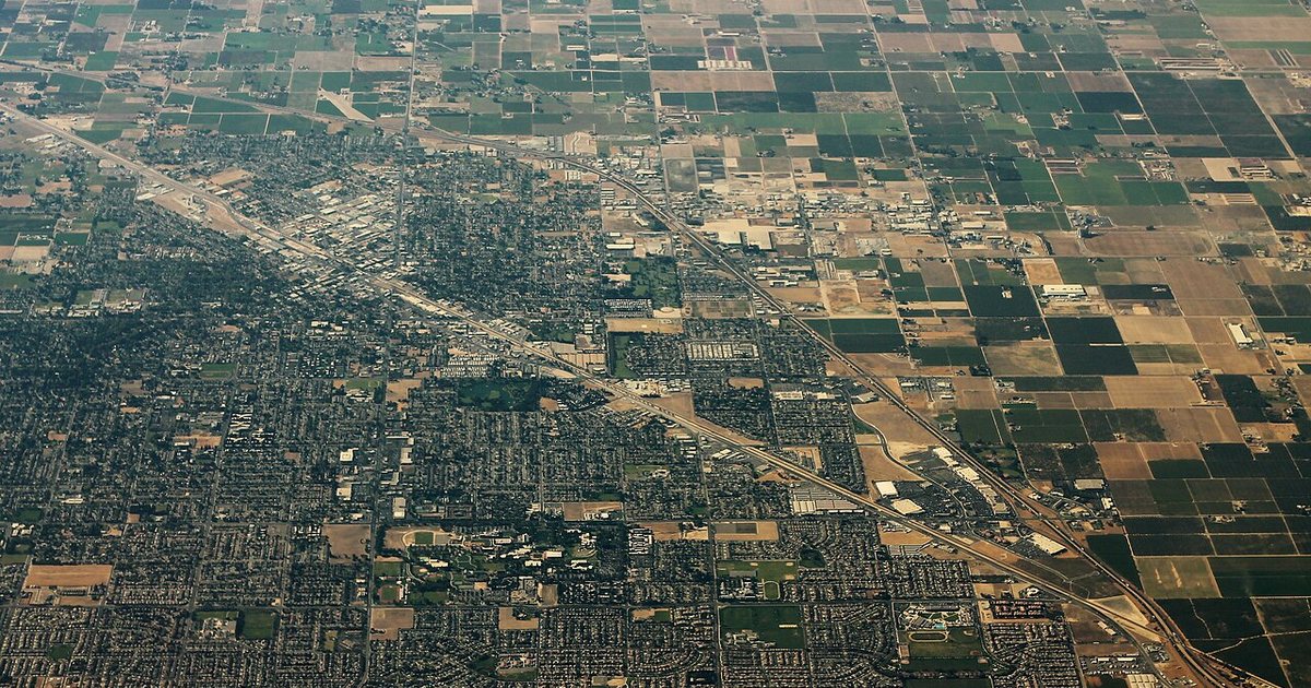Aerial view of Turlock with neighborhoods and surrounding agricultural land.