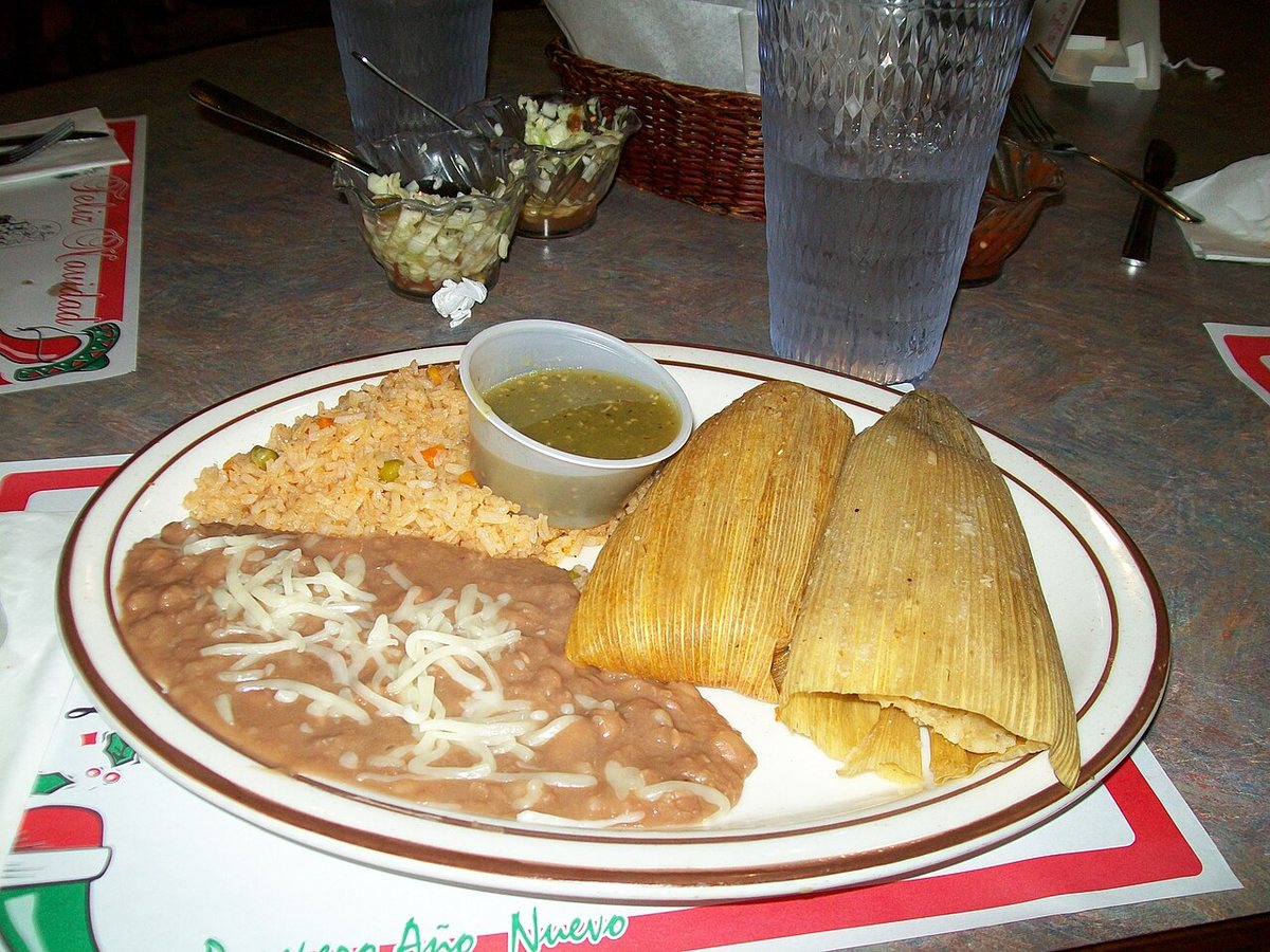 Two tamales served with beans and rice at a Turlock restaurant.