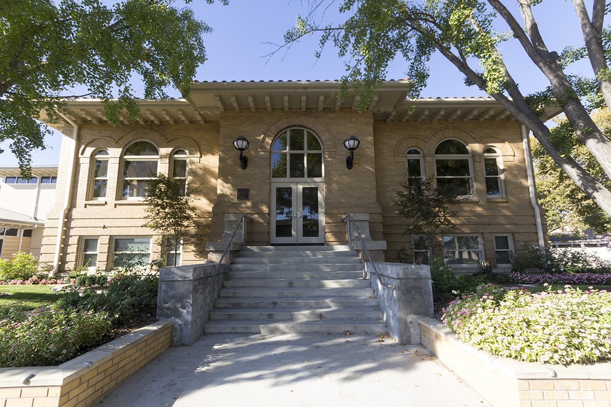 The historic Carnegie building in Turlock, with arched windows and steps leading to the entrance.