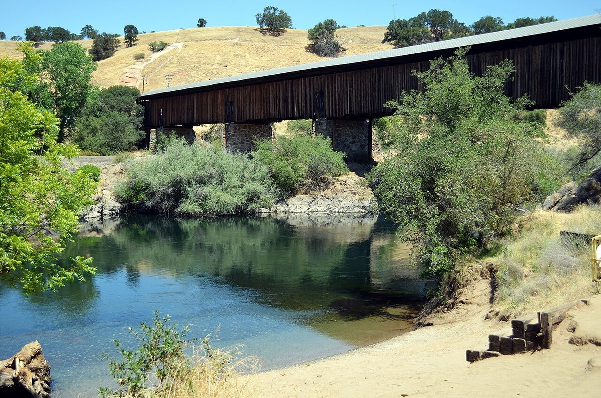 The wooden Knights Ferry Covered Bridge beside the Stanislaus River near Oakdale.