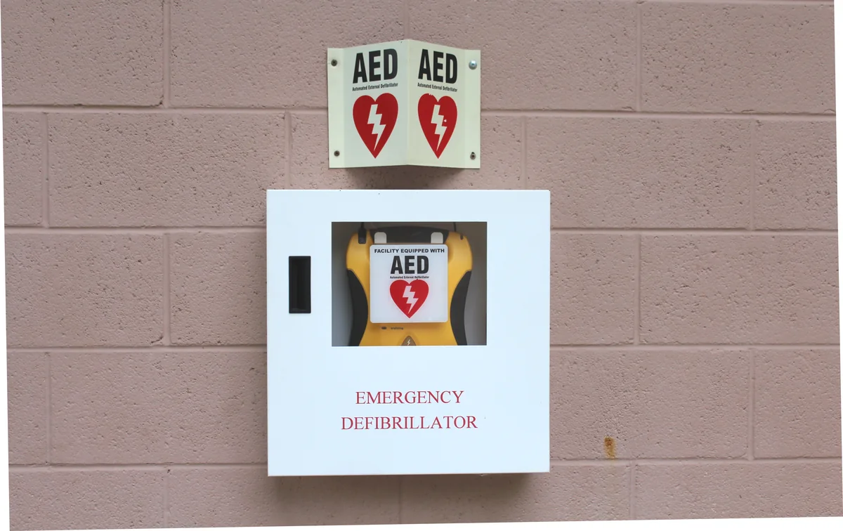An automated external defibrillator cabinet and AED signs at a Michigan recreation area