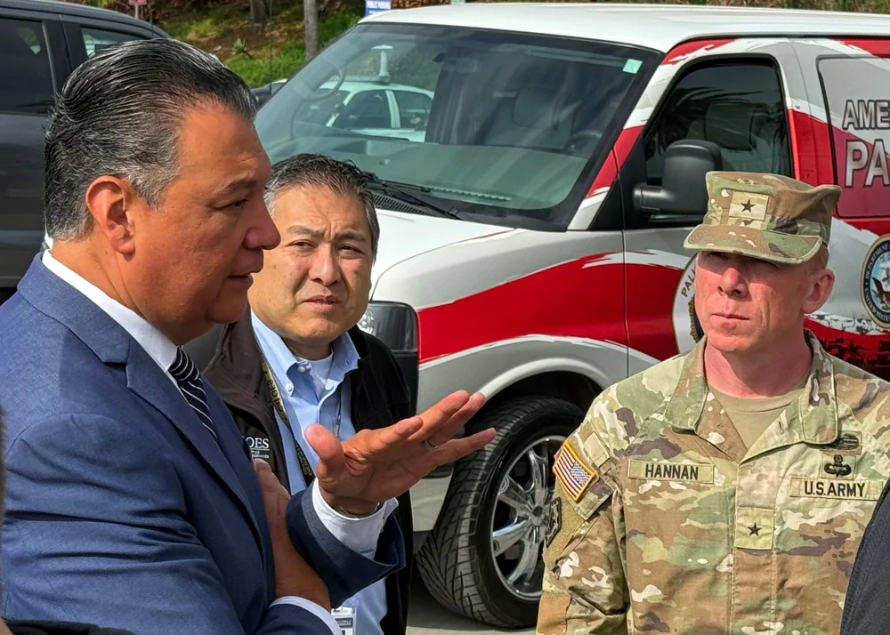 Alex Padilla speaking with disaster-recovery officials in Pacific Palisades in April 2025.