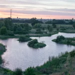 The winding pond below the bluff at Ceres River Bluff Regional Park at sunset.