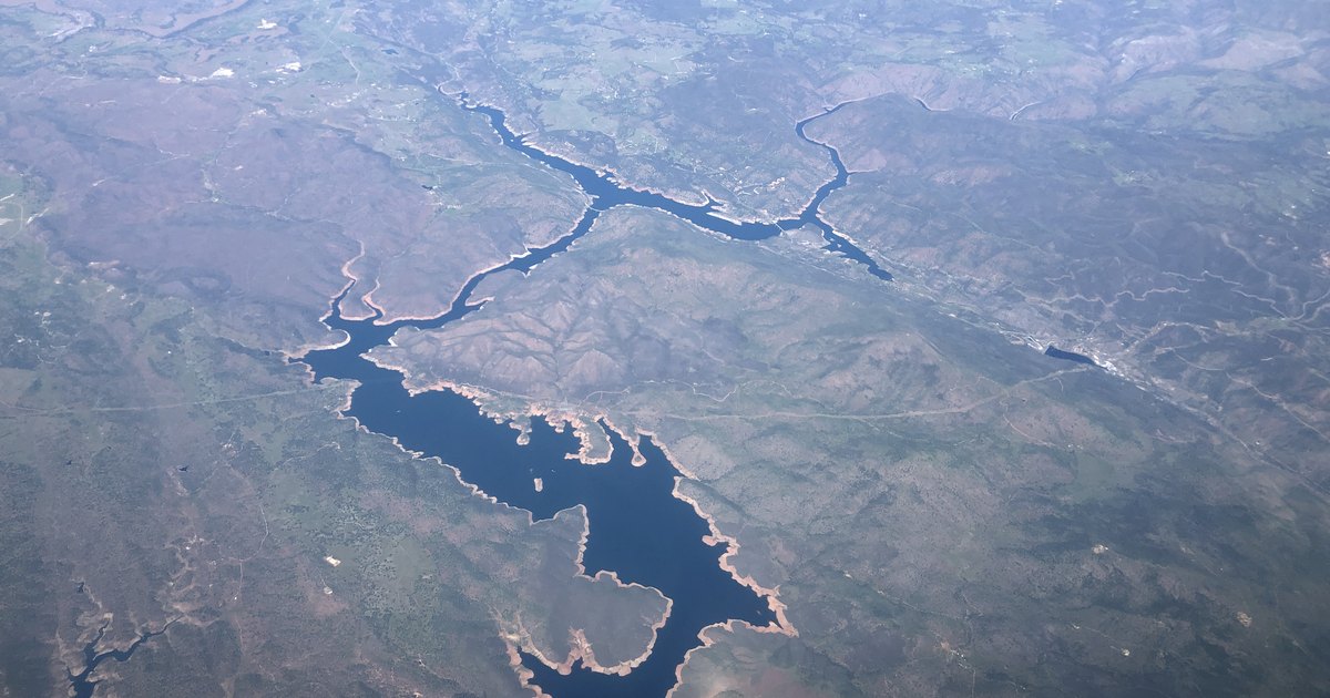 The northern arms of Don Pedro Reservoir winding through Sierra foothills in an aerial photograph