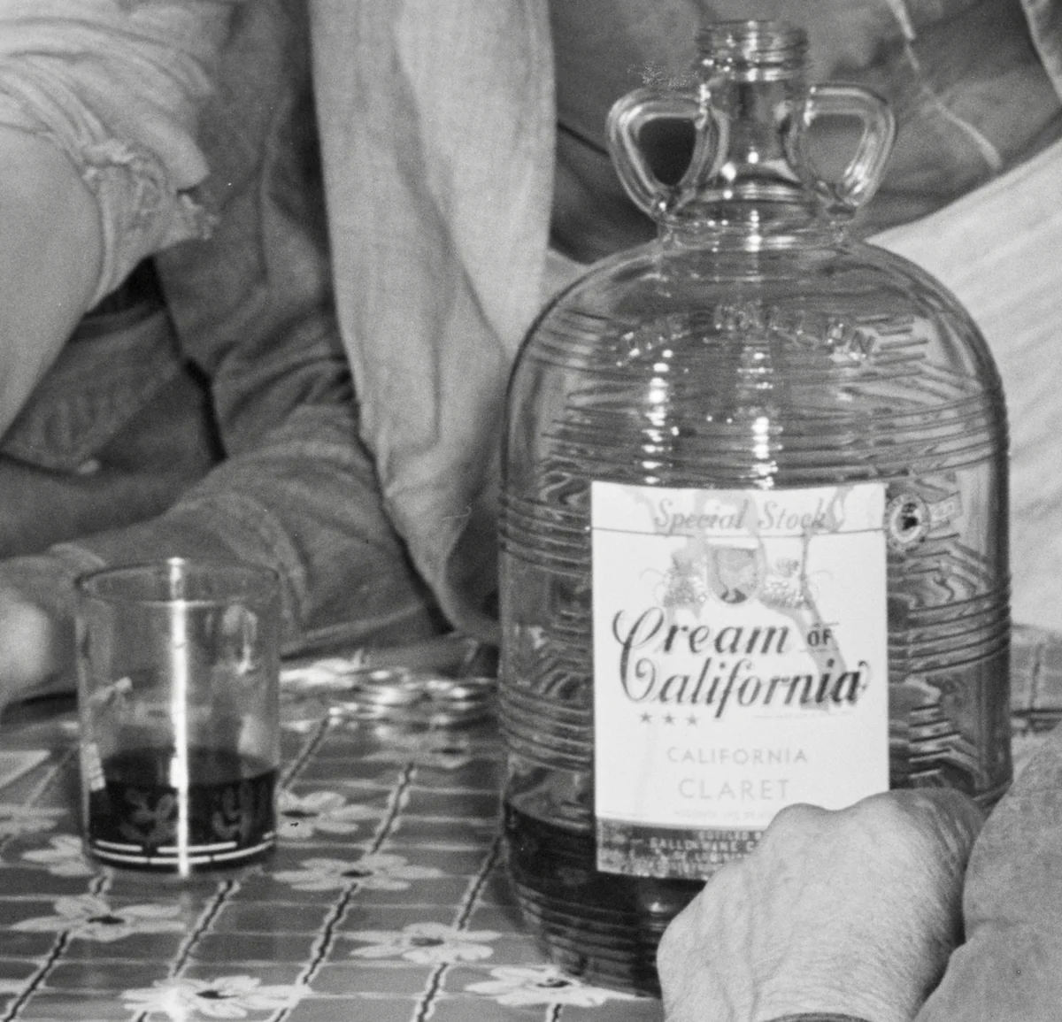 Cream of California Claret wine bottle on a card table in Delacroix, Louisiana, in 1941.