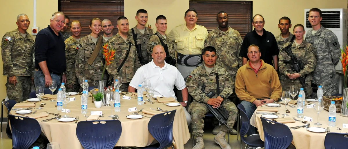 Jeff Denham and other members of a congressional delegation pose with service members at Kandahar Airfield in 2011.