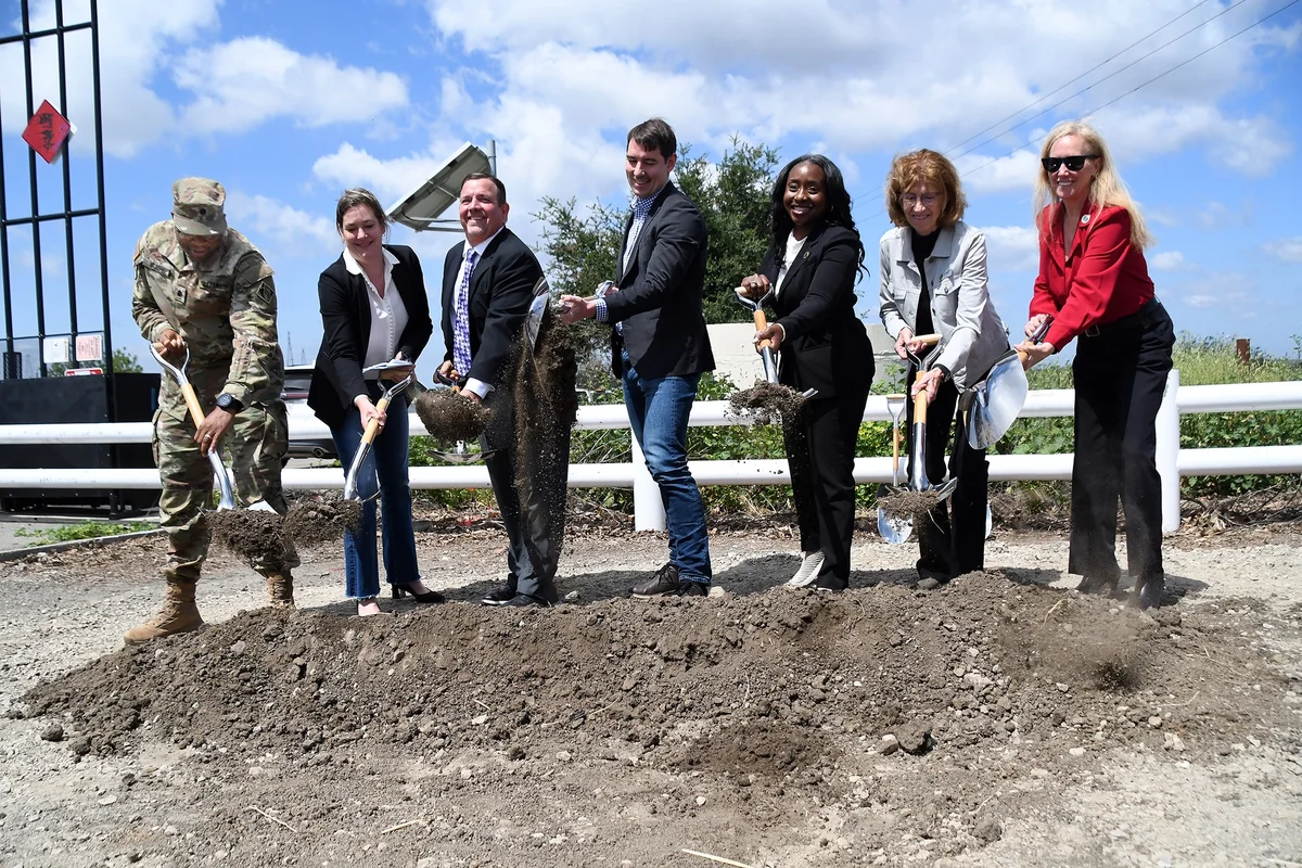 Josh Harder, fourth from left, joins officials with shovels at a Stockton flood protection project groundbreaking in April 2025