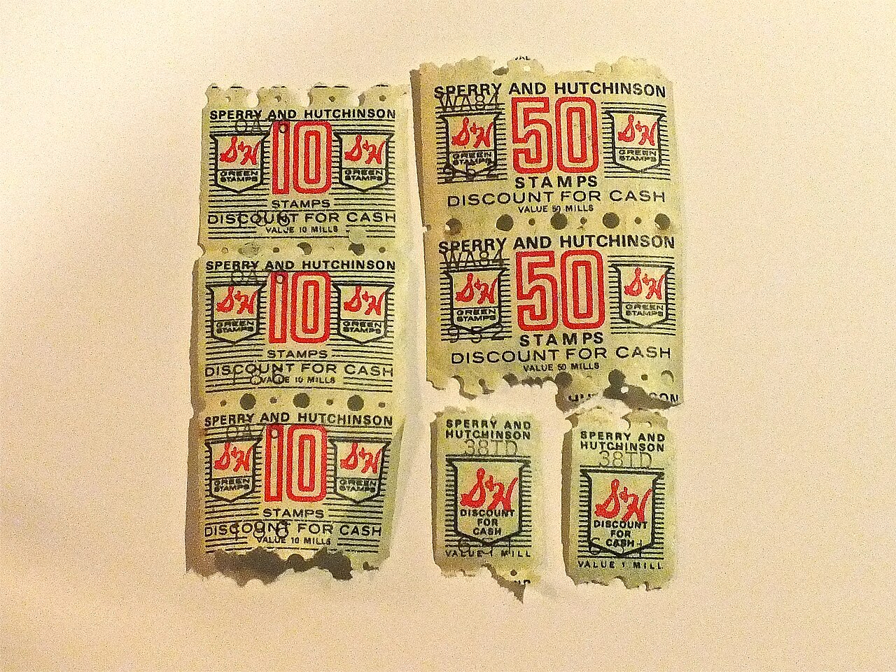 Sperry & Hutchinson Green Stamps in one-, ten- and fifty-stamp denominations, photographed in 2013.