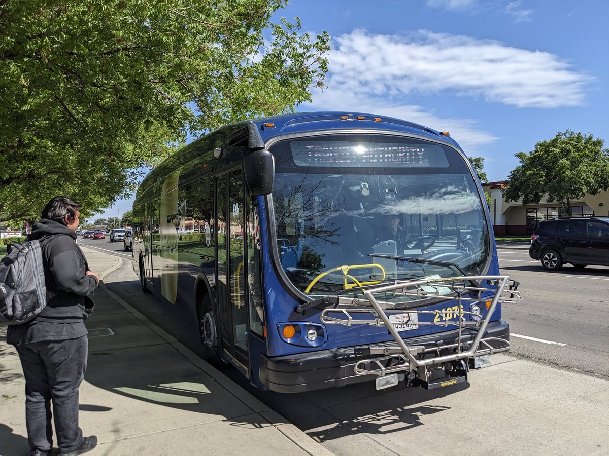 A blue StanRTA bus stopped at the curb near Monte Vista Crossings in Turlock.