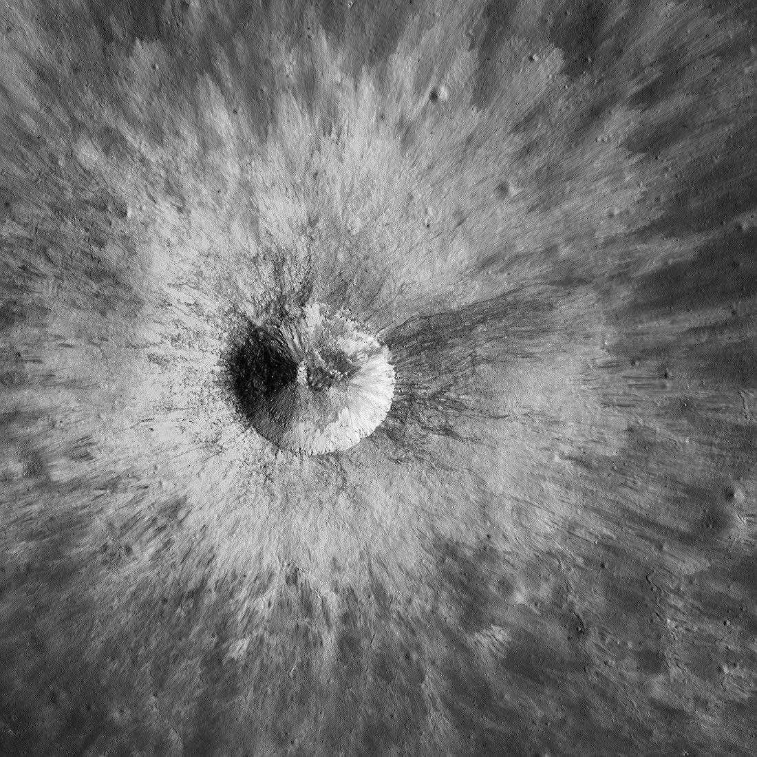 A lunar impact crater and its bright rays, seen from orbit by NASA's Lunar Reconnaissance Orbiter.