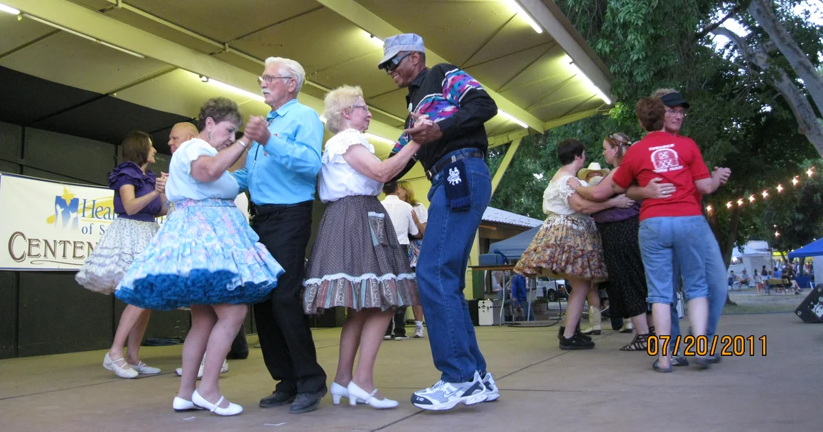 Couples square dance on a stage at the Stanislaus County Fair in Turlock in July 2011.