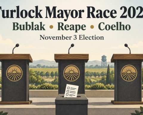 Three empty debate podiums and a ballot for the 2026 Turlock mayoral election.